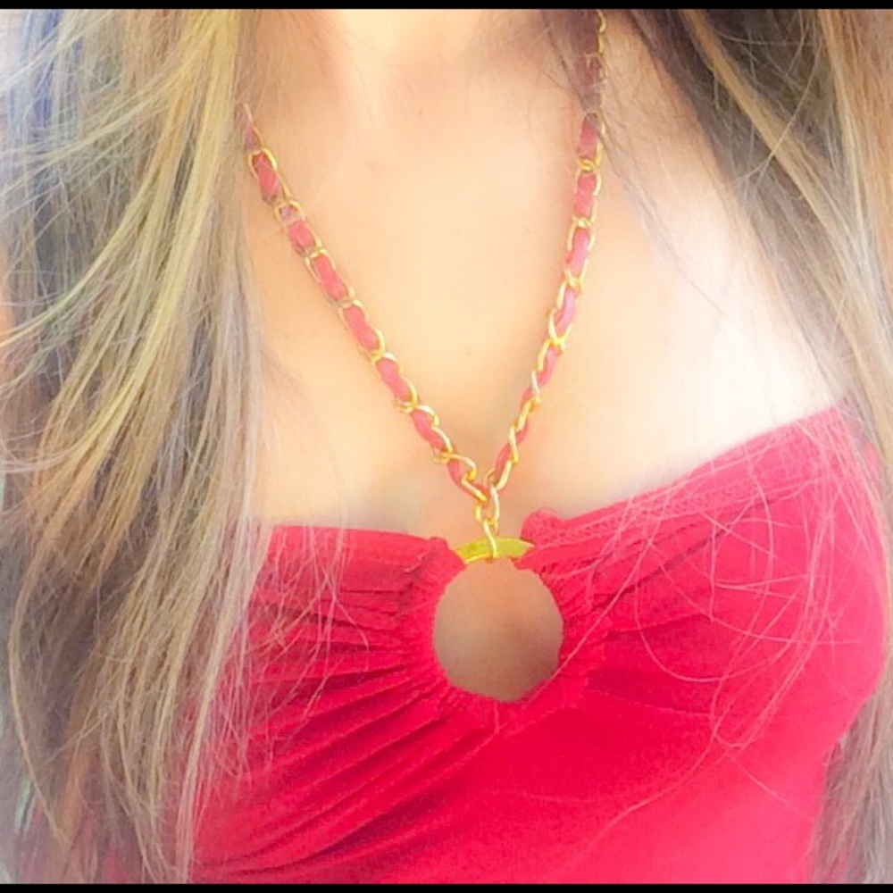 red halter top with gold colored faux leather chain